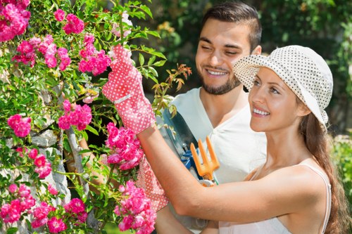 Person using screen reader and a laptop to access garden service information